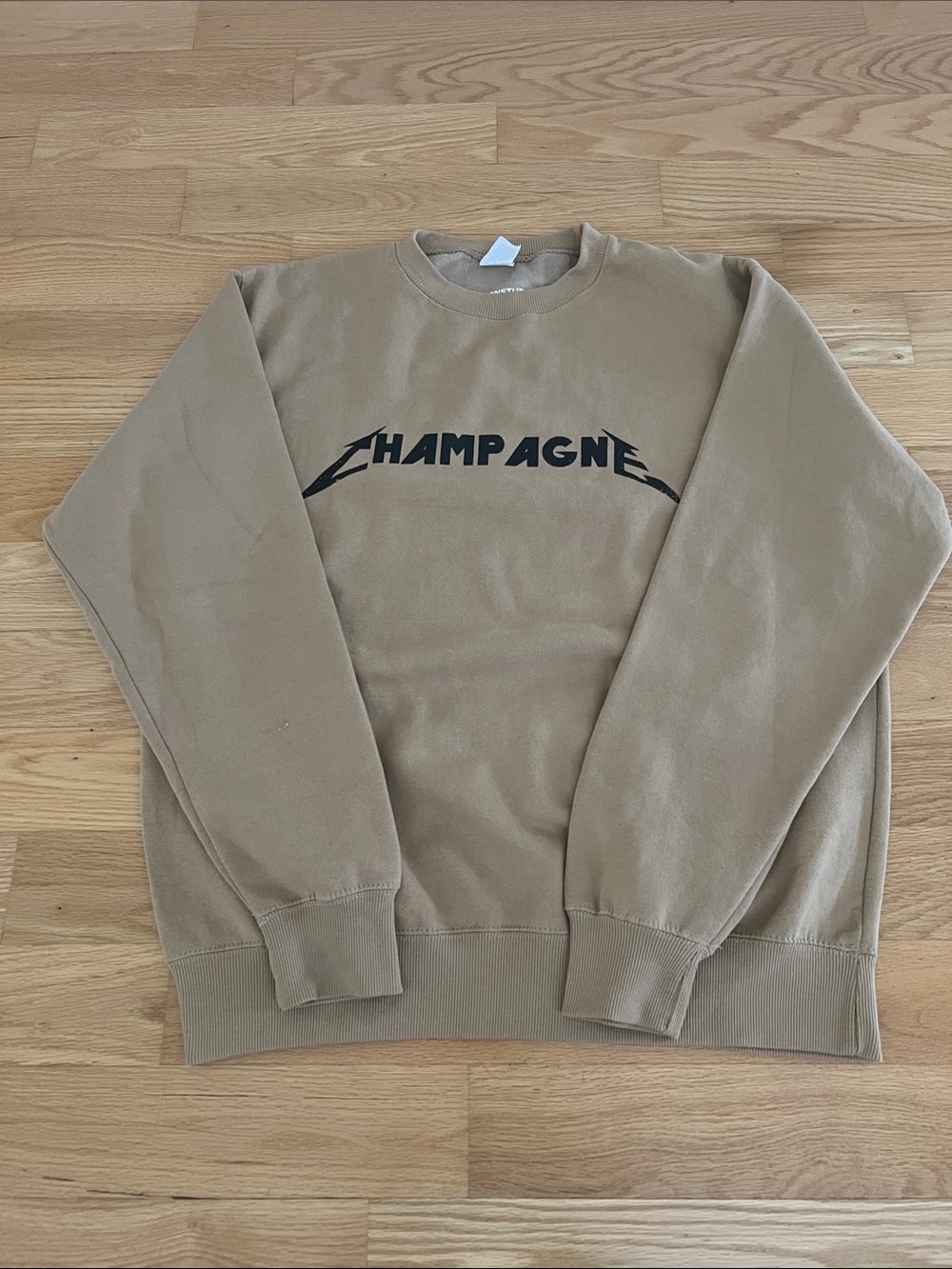 Champagne Tan Teddy Jacket with Black Logo
